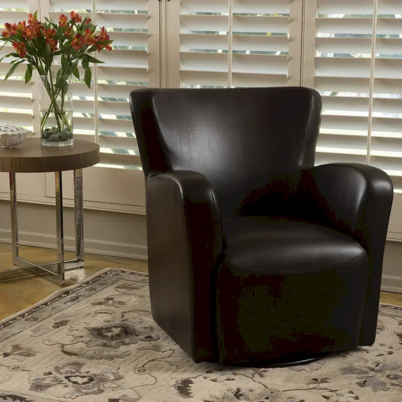 Fauteuil décoratif pivotant à dossier ailé en cuir contrecollé