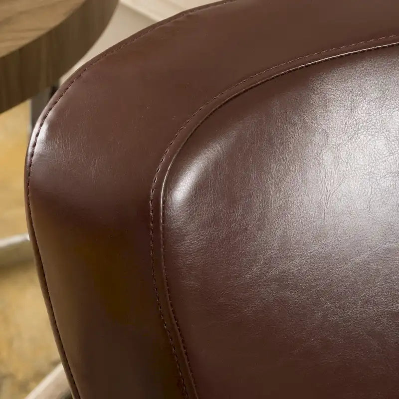 Fauteuil décoratif pivotant à dossier ailé en cuir contrecollé
