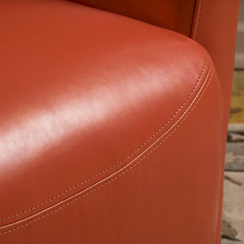 Fauteuil décoratif pivotant à dossier ailé en cuir contrecollé