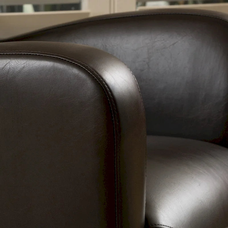 Fauteuil décoratif pivotant à dossier ailé en cuir contrecollé