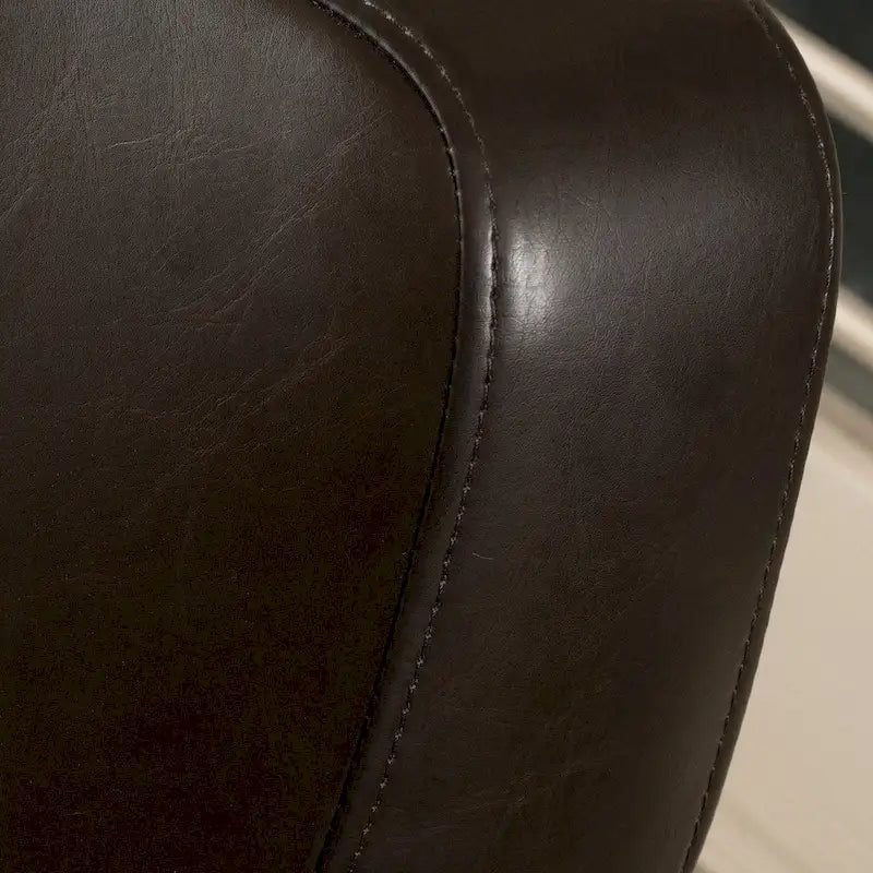 Fauteuil décoratif pivotant à dossier ailé en cuir contrecollé